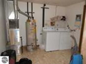 11x10 utility roombedroom with access out to backyard.