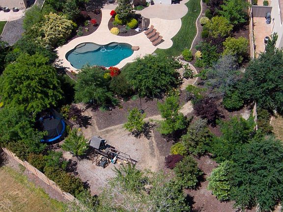Arial view of the spacious, beautifully landscaped backyard