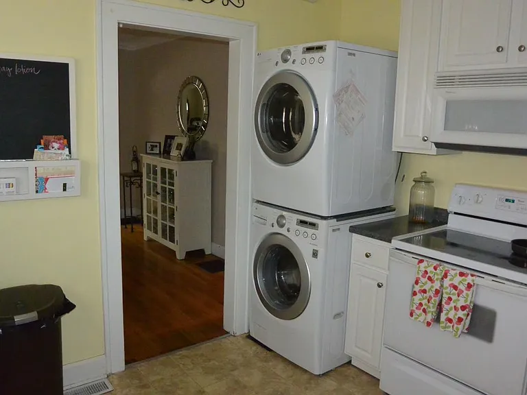 Kitchen dishwasher, fridge, glass to stove and built in microwave. High efficiency washer and dryer included.