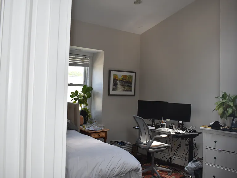 King size 2nd bedroom w/high vaulted ceilings and skylight. (furnished)