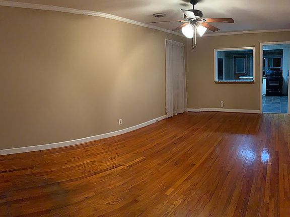 Den area with peekaboo bar