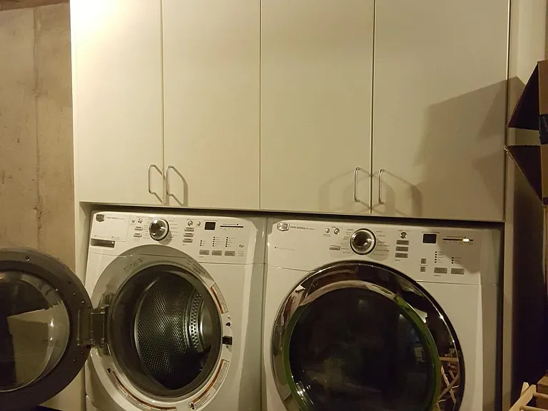 In_unit washer and dryer with storage cabinets _ rare for Middleton rentals
