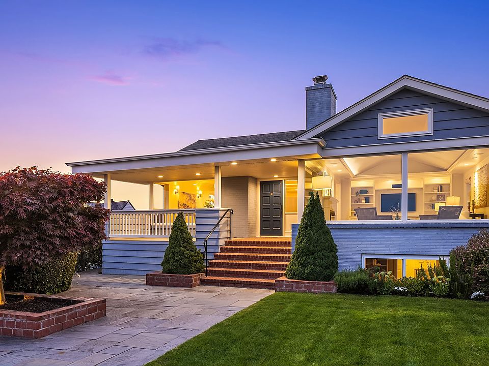 Perfect sited, you feel on top of the world. Walls of windows on the South and West sides of the home, designed to maximize the incredible city, sound, and mountain views