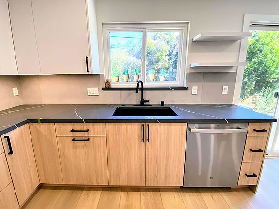 New modern Quartz countertop with all black composite sink