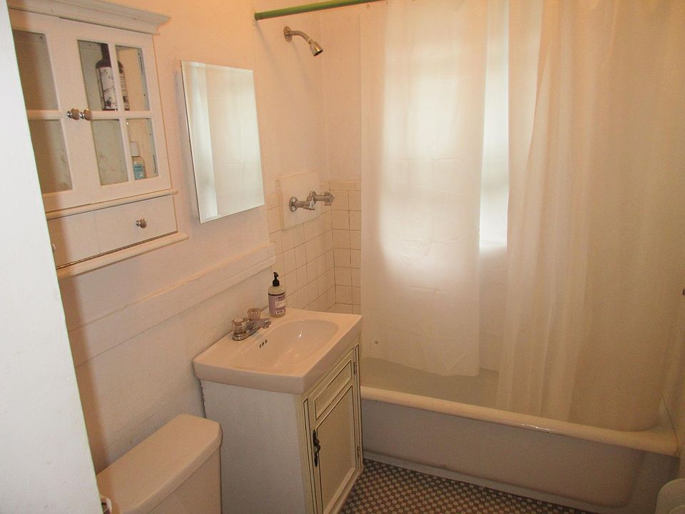 One full bathroom with two medicine cabinets.