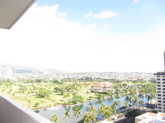 View of canal, golf course and mountains