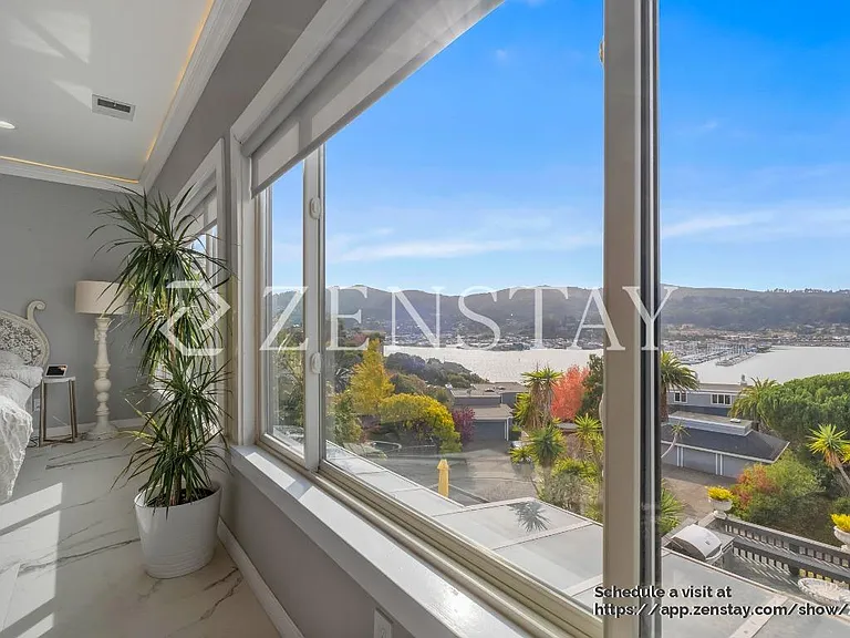 Primary bedroom with sweaping Richardson Bay views