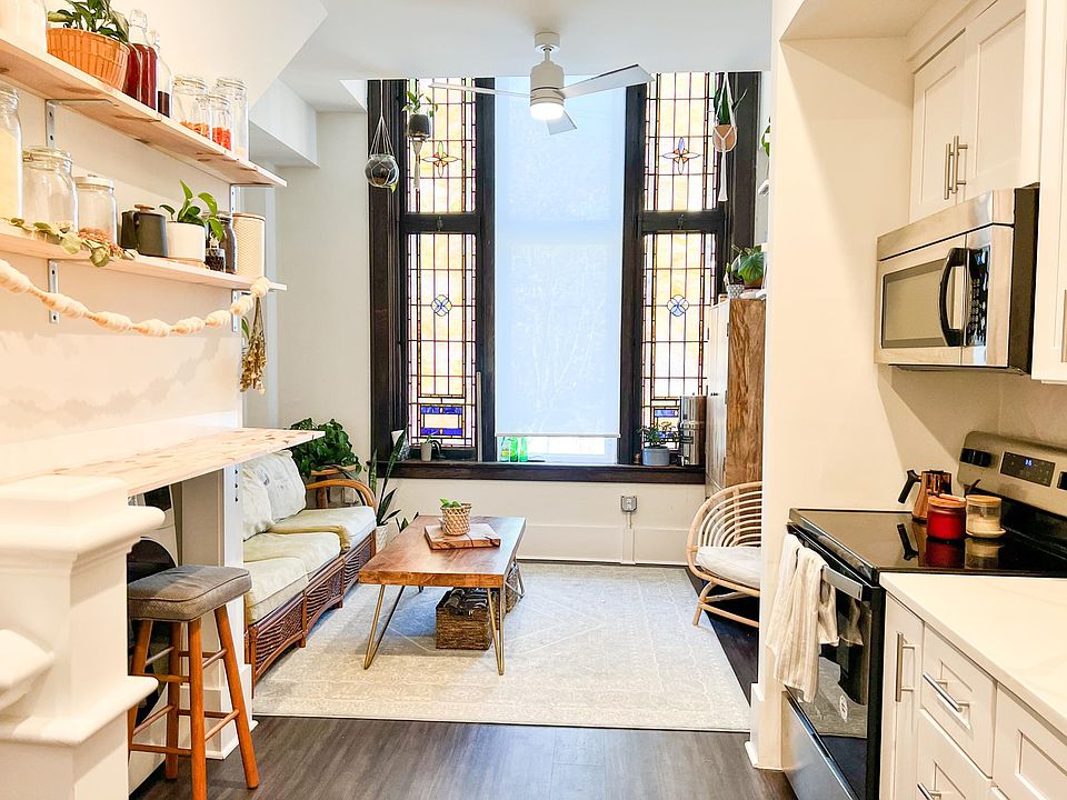 Stained glass and cozy corners accentuate the beauty of this unique loft in the heart of the arts district. *Photo similar to available unit