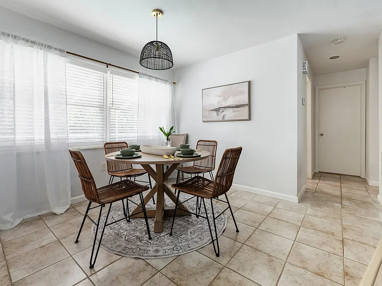 The dining area looks over the pool.