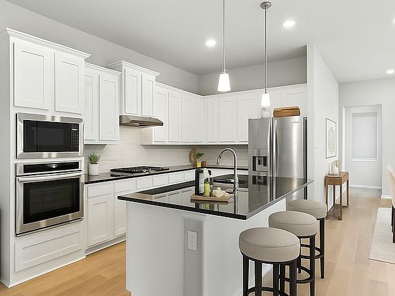 Gorgeous and upgraded kitchen with gas cooktop and convection oven. Refrigerator is included!