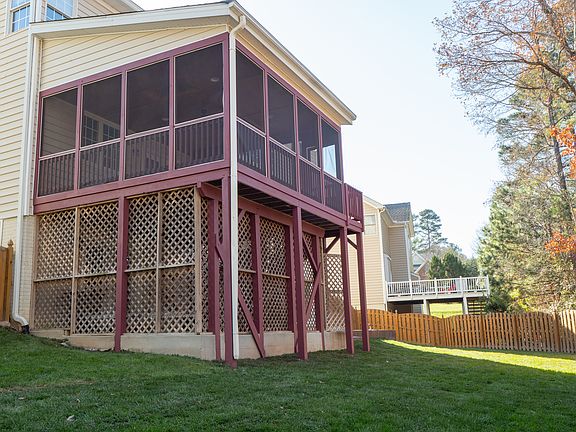 Indoor screen porch with storage beneath