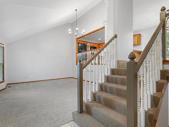 View from Entry - stairs up to kitchen and down to finished walk out basement & garage