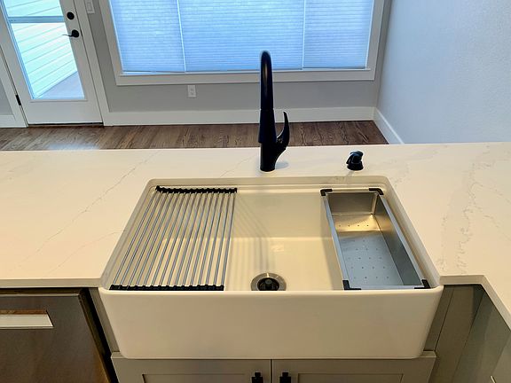 Farmhouse sink with accessories.