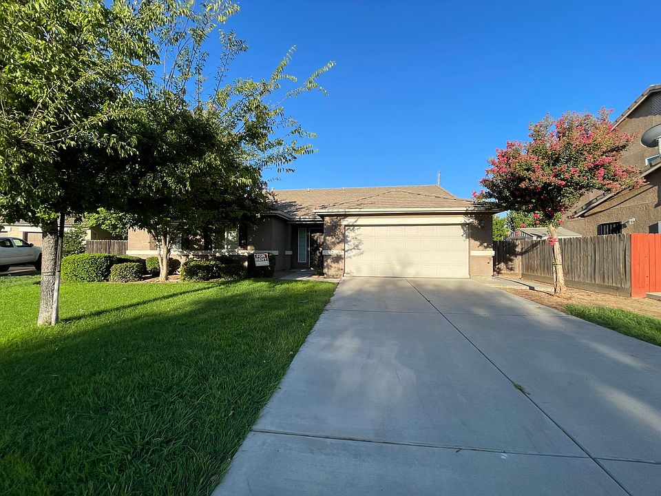 Exterior, driveway approach to the two car garage.