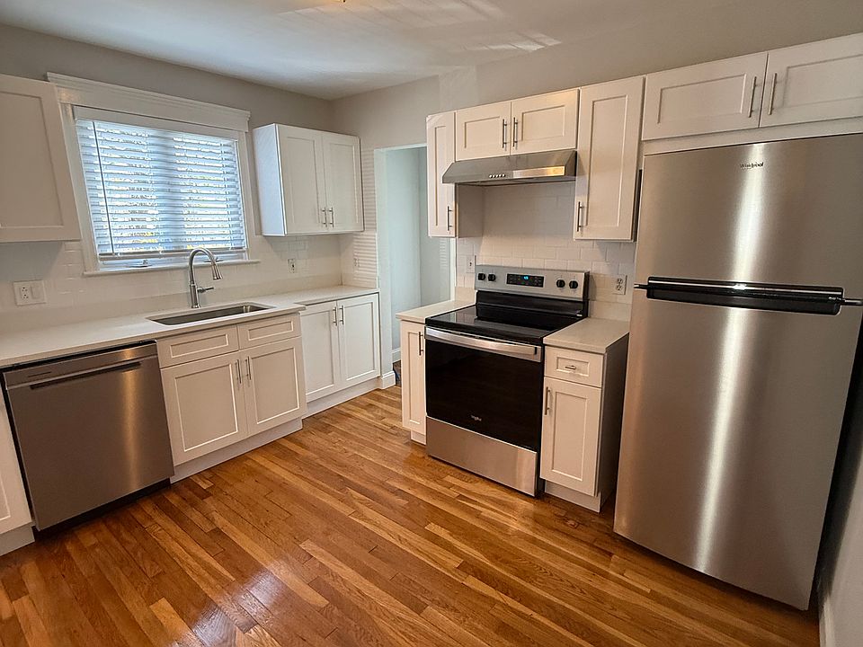 Brand new appliances and modern white cabinetry and counter tops