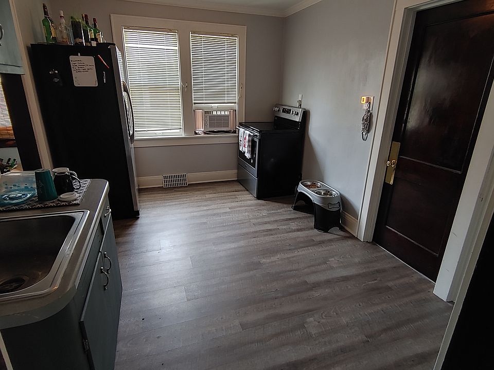 Kitchen and rear entry (stairway to basement and exit to driveway)