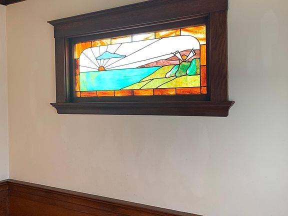 Original stained glass window in large foyer