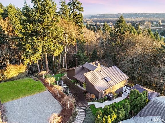 Positioned on .5 acres with stunning views of Mt. Rainier to the Port of Tacoma.