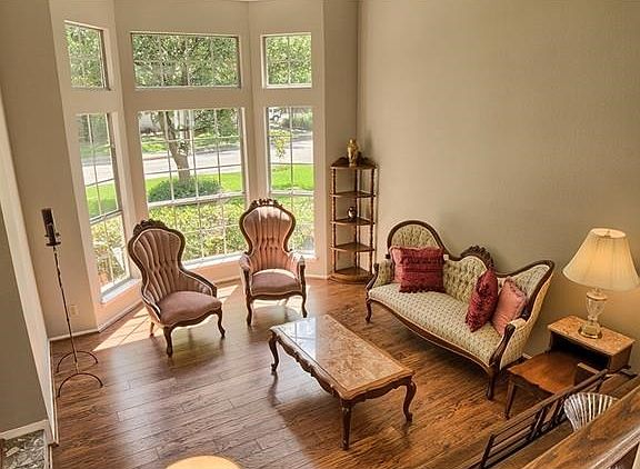 Cozy formal living room with hardwood flooring