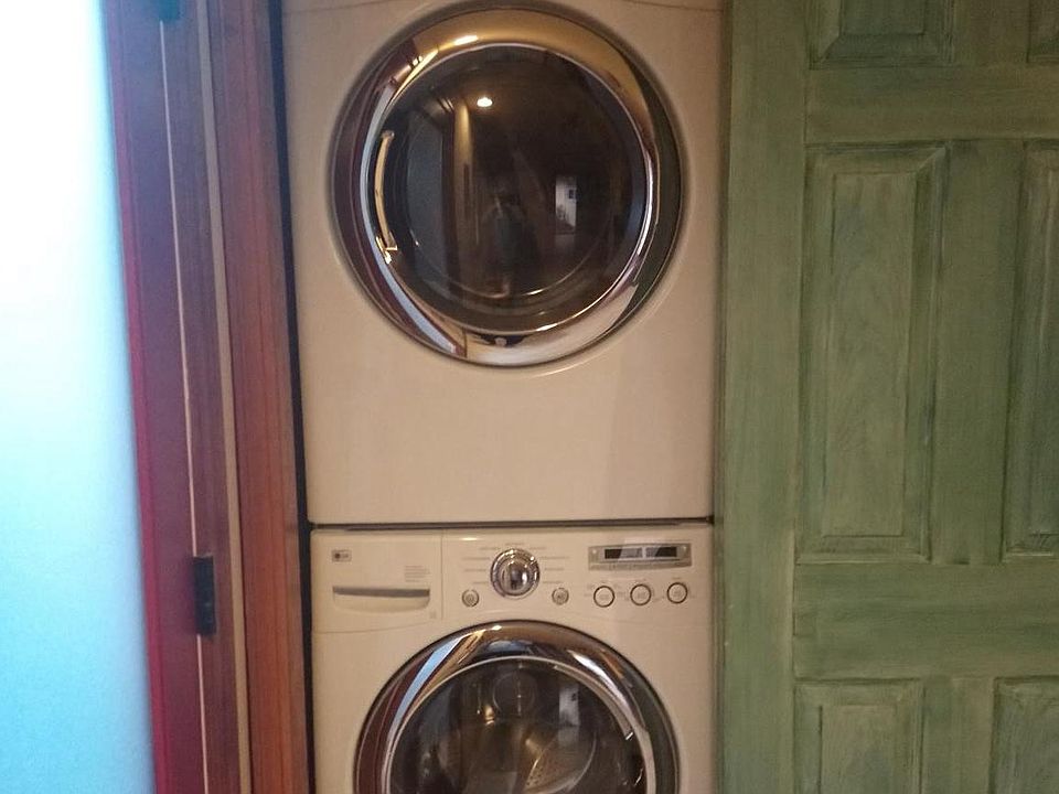 LG washer/dryer right inside the door, to the left of the kitchen.