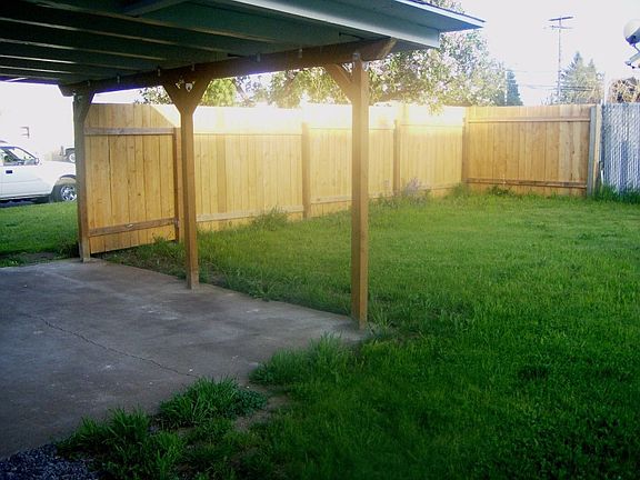 Covered parking & Large corner lot