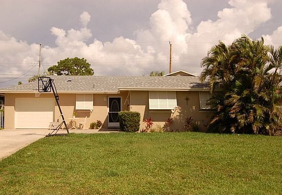 New Paint on Exterior complete with Hurricane Shutters and Sprinkler System