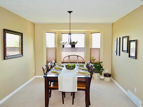 Dining room with bay window and west-facing bay window