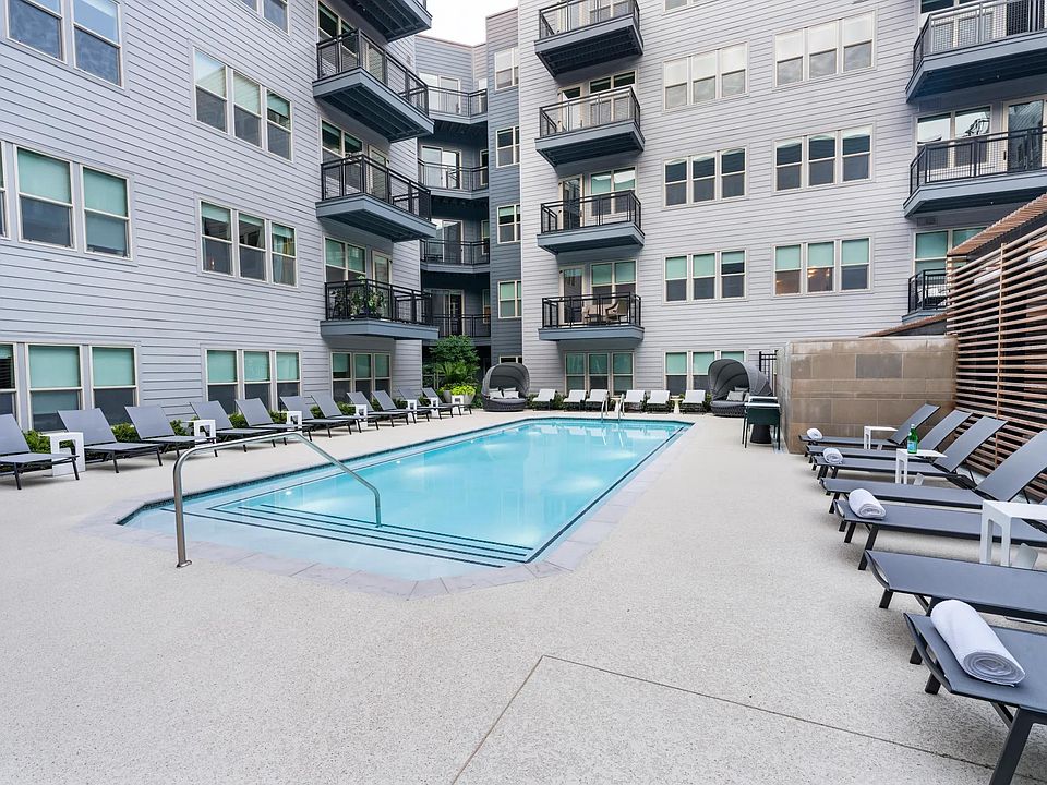 Relax by the sparkling courtyard pool_perfect for a refreshing dip or unwinding in a private lounge chair.