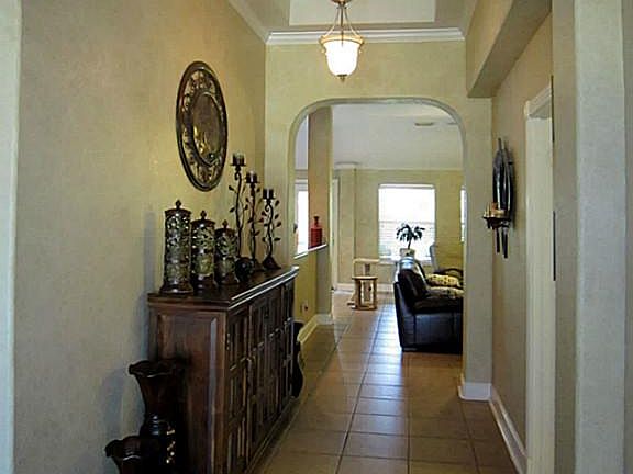 Tile and hard wood floors throughout this open concept floor plan home.