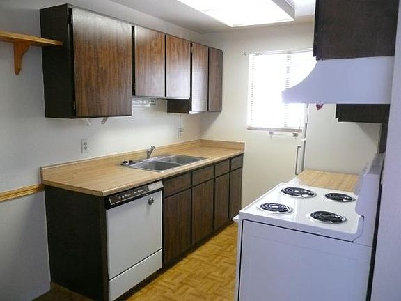 Kitchen: sink with garbage disposal, dishwasher, stove & refrigerator.