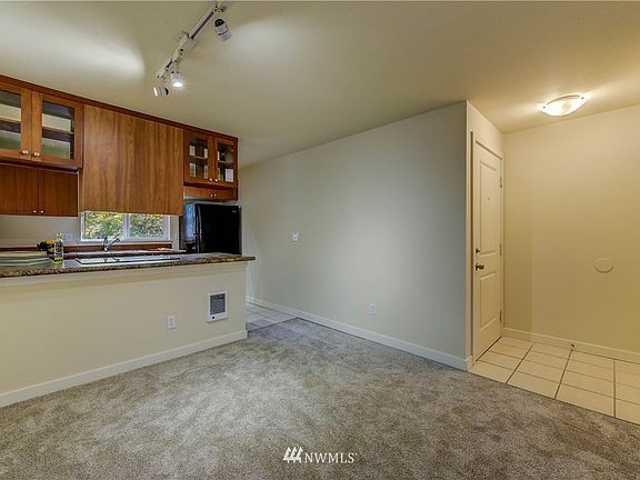 Tile entry way with coat closet opens into main living area.