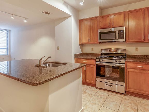 Kitchen with Island and Stainless Steel Appliances