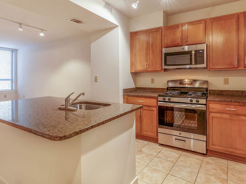 Kitchen with Island and Stainless Steel Appliances