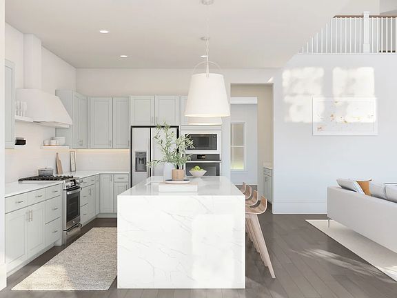 Kitchen with center island and quartz countertops