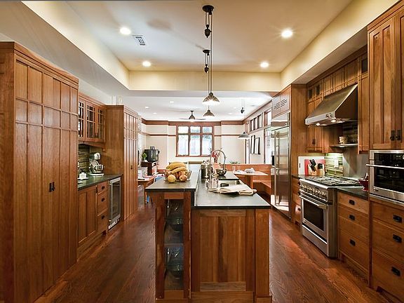 Gourmet Kitchen complete with soapstone counters, hand crafted cabinets and wet/wine bar.