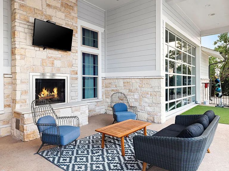 Outdoor Lounge with Fireplace and Comfy Seating