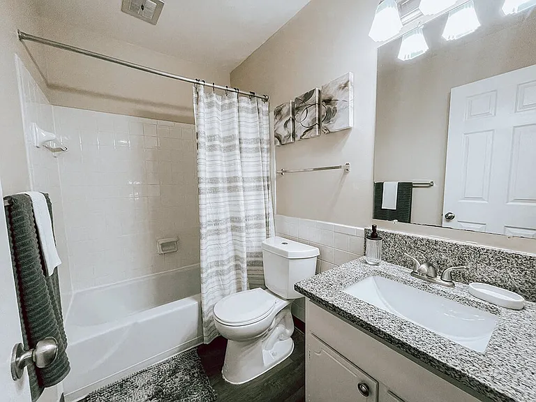 Full Bathroom with Granite Counter