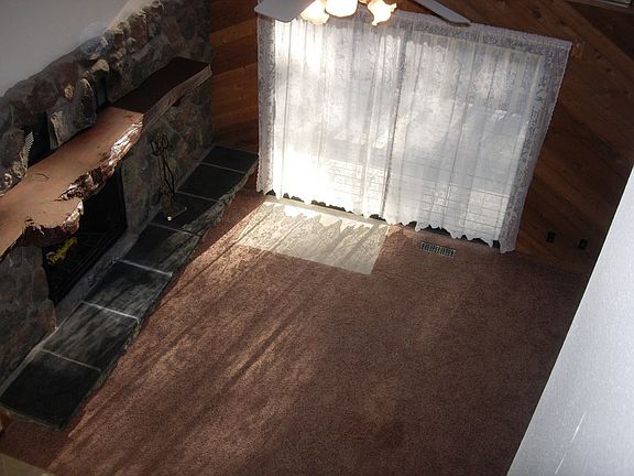 Living room view of mantel from stairway