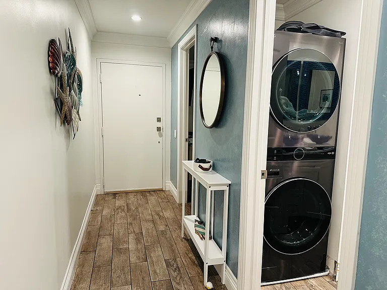 Entry hall and washer and dryer.