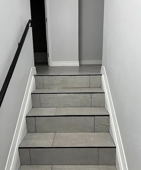 Stairwell, Brand New Tile and Grout, New Baseboard and Molding, Handrails, Chandelier Light. Freshly Painted Ceiling, Walls, New Baseboards and New Moldings.