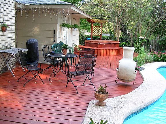 Beautiful deck, planter, waterfalls, hot tub!