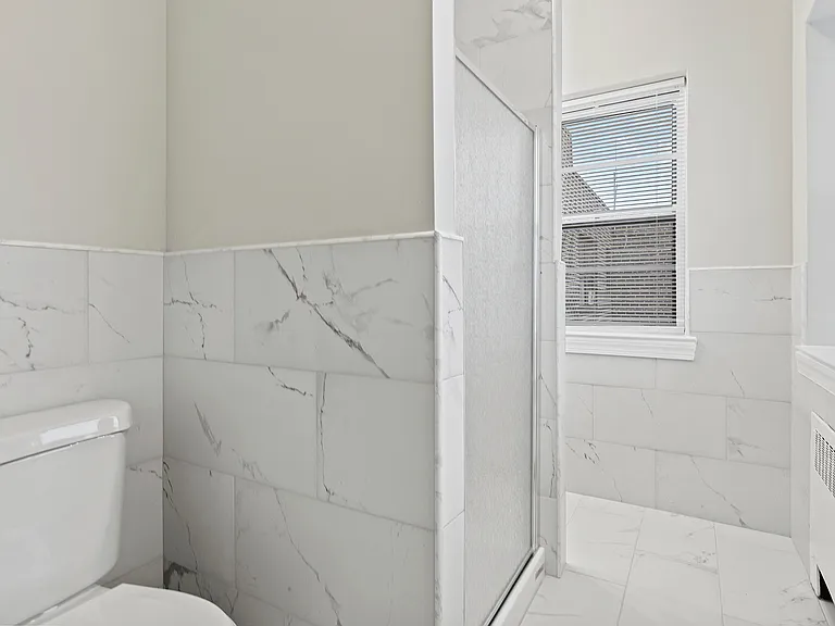Experience luxury in this elegantly designed bathroom, where modern meets comfort.