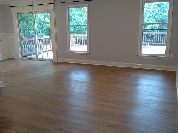 Main living area and dining area, very bright, sunny, and welcoming, new laminate flooring!