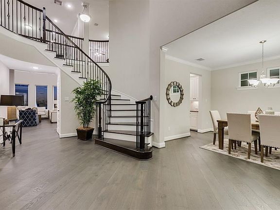 As you enter this Showplace you will be captivated by the Grand Curved Staircase with Iron Railing and Wood Stairs. The Neutral Paint and Wood Floors along with the abundance of Natural Light along with the Views of the Water awaiting you is an amazi