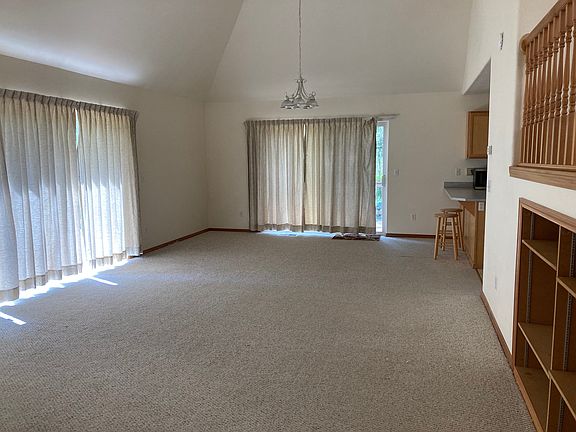 Living room and dining room with shelves