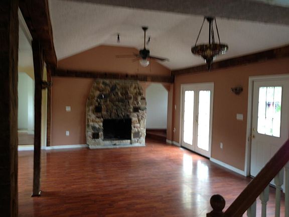 Open floor plan with kitchen opening into living area