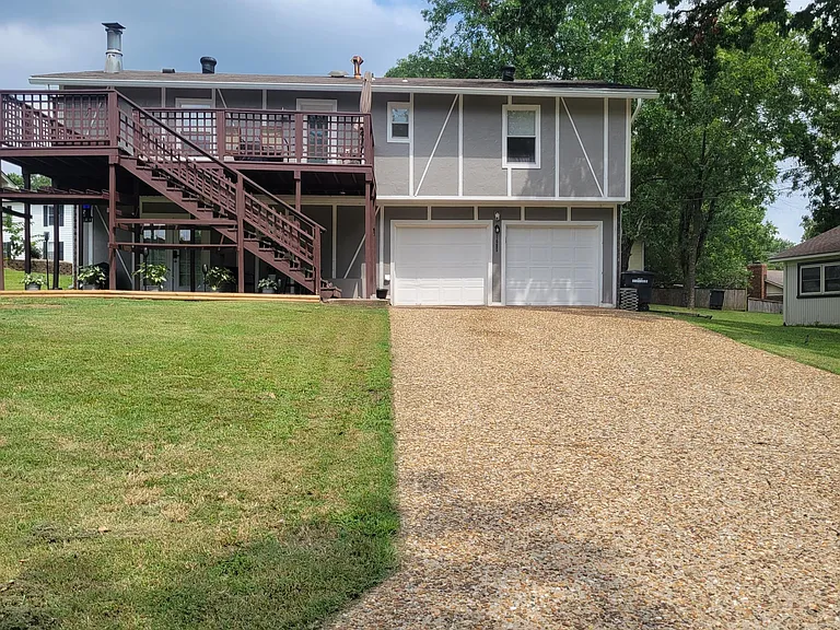 Driveway with tandem parking for 3 cars in the left. Apt is on the bottom left