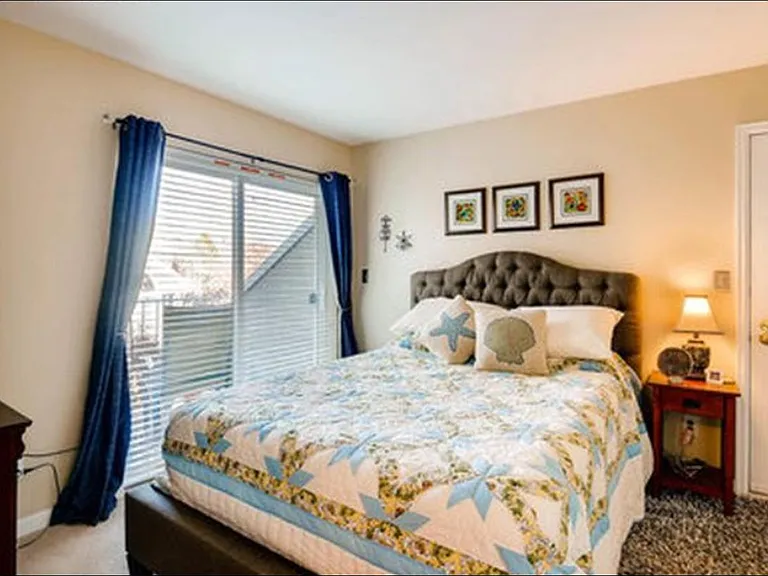 Second floor bedroom with porch with double french door entrance