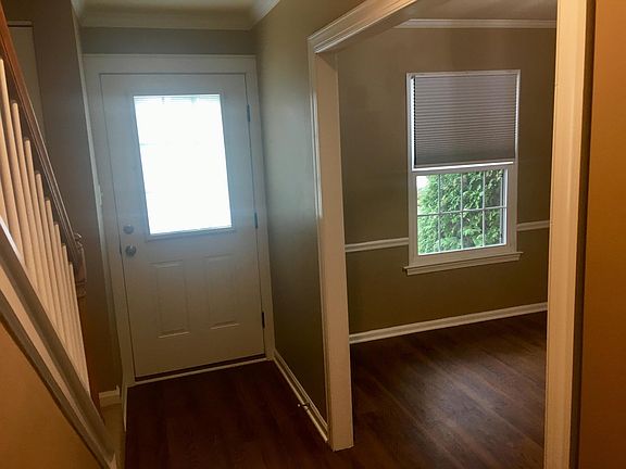 View of Front entrance from hall. Dining area on the right side of photo.