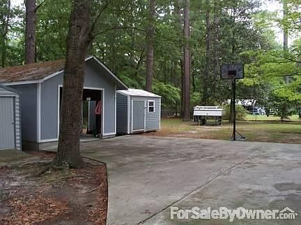Driveway into Garage with Shed